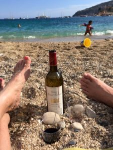 This wine was lovely but the point is to show the type of peebled sand on top of my foot.