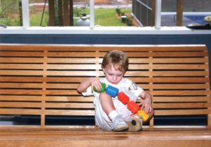 A boy and his trains! Andy was always all about trains. I love this scene where he is so intriged with his favorite pull-apart train beads, at age 2. 